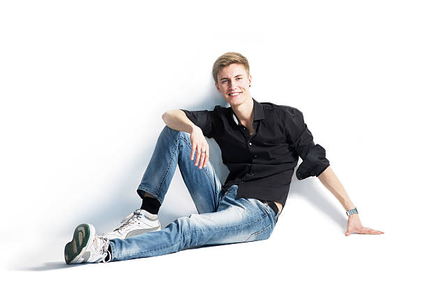 istock Man sitting on the floor. Isolated on white background 496647345