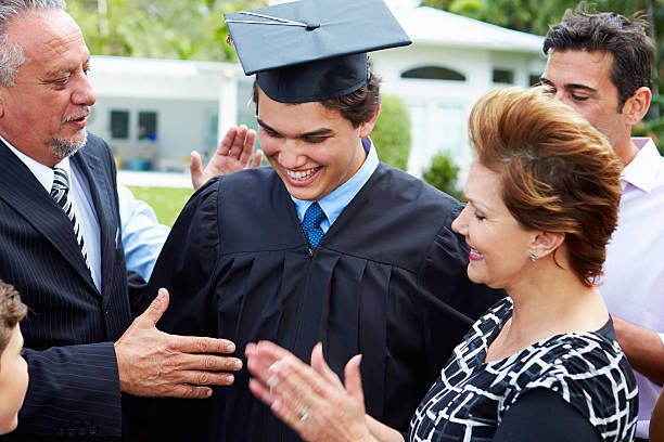 istock Hispanic Student And Family Celebrating Graduation 496647365