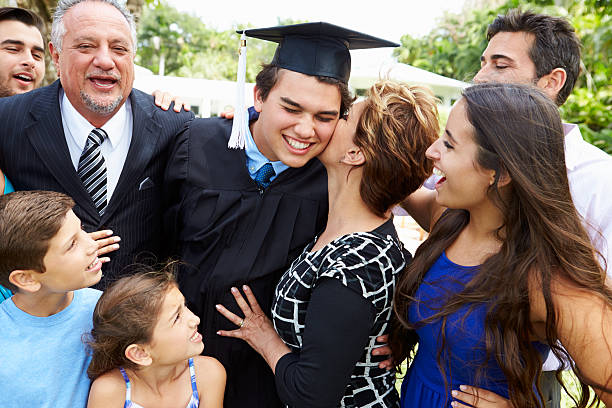 istock Hispanic Student And Family Celebrating Graduation 496647399