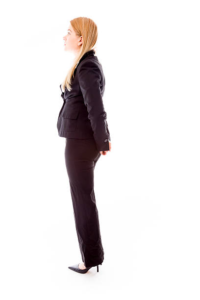 istock Profile of a businesswoman standing with hands behind back 496647455