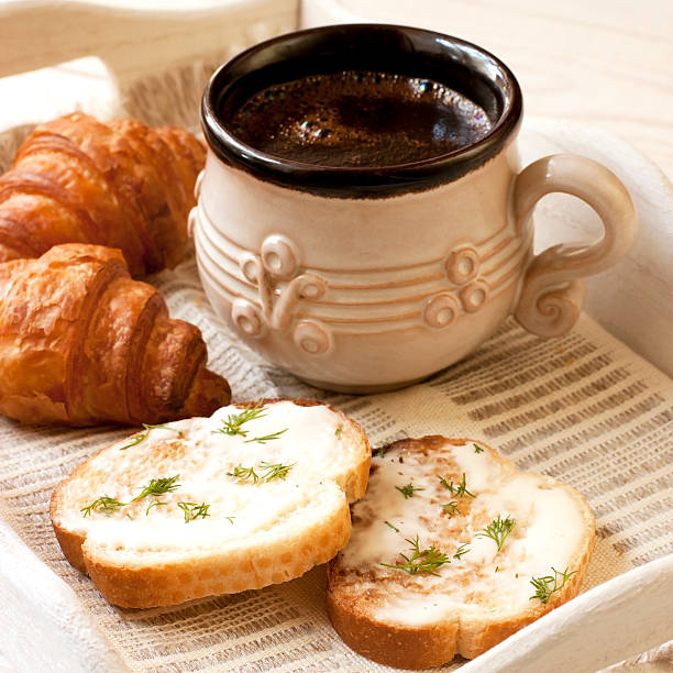 istock Breakfast with toasts, coffee  and croissants 496648287