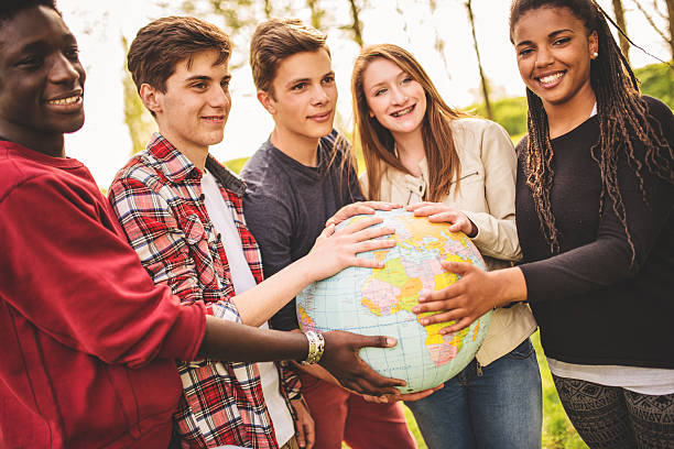 istock teenagers college student smiling with globe 496648999