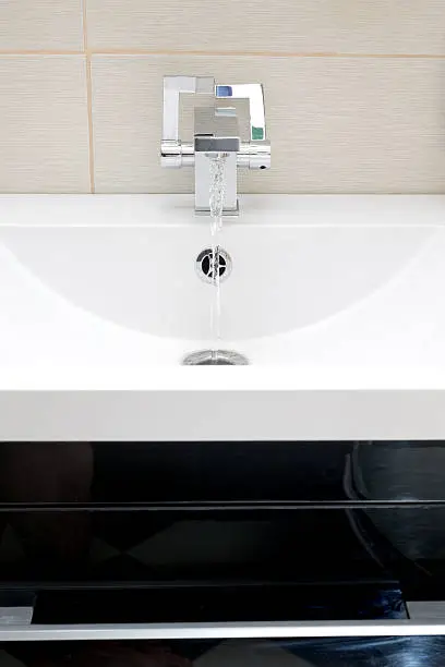 Chromium-plate tap on white sinkChromium-plate tap on white sink