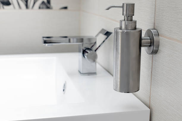 istock Chromium-plate tap on white sink. 496651719