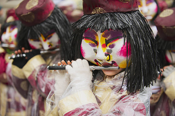 Traditional daytime procession at Basler Fasnacht. Basel, Switzerland - March 02, 2009: Unidentified women play flutes at Basel Carnival in Basel, Switzerland. fastnacht stock pictures, royalty-free photos & images