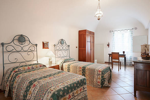 istock Old bedroom with two beds in ancient interior 496659486