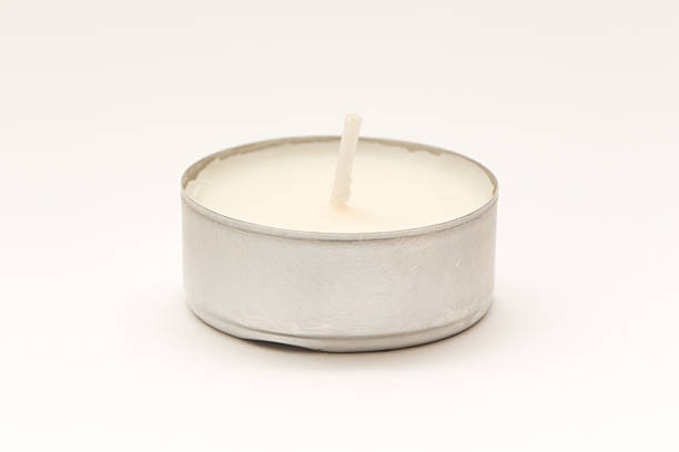 свеча с ароматом белого чая - tea light candle white single object стоковые фото и изображения