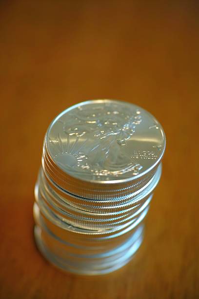 stack of real silver coins stock photo