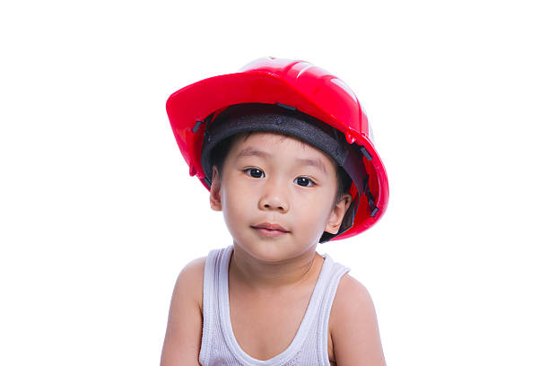 istock Boy in a white singlet wearing red helmet 496661261