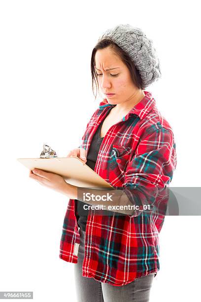 Young Woman Writing On Clipboard Isolated On White Background Stock Photo - Download Image Now