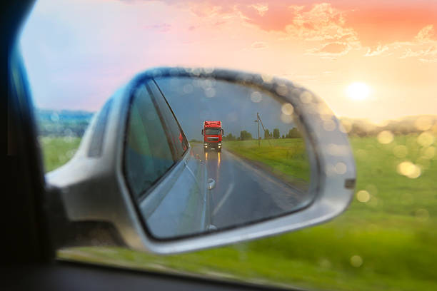istock reflection of truck in car mirror 496662062