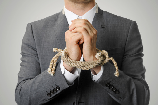 businessman with a rope tied hands