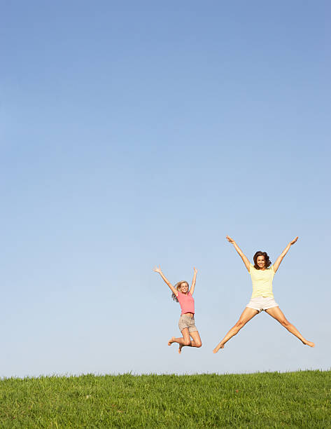istock Young women jumping in air 496662289