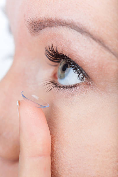 istock Woman eye with contact lens applying 496662835