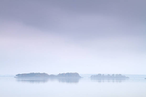 istock fog over the sea and the island 496662921