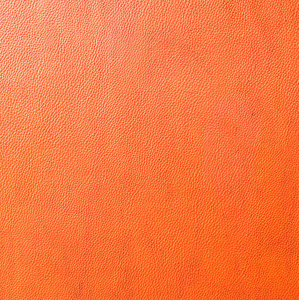istock backgrounds of orange leather texture 496663197
