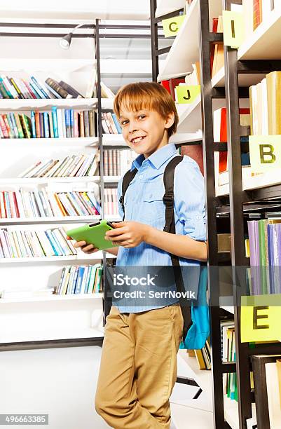 Smiling Schoolboy Stands And Holds Books Stock Photo - Download Image Now - Beautiful People, Beauty, Book