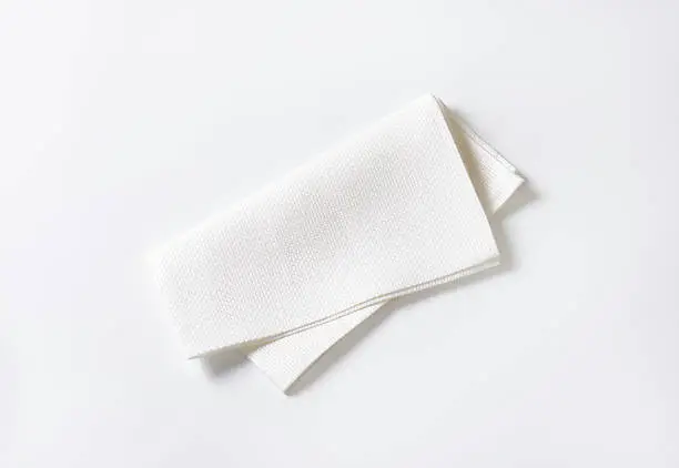 Single clean white fabric napkin