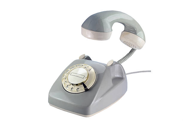 istock gray rotary dial phone with flying telephone receiver isolated o 496663970