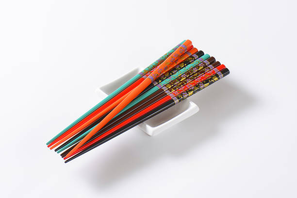istock Set of ornate chopsticks on small rectangle bowl 496664200