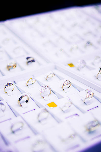 istock many gold rings on display at a jewelry store 496664433