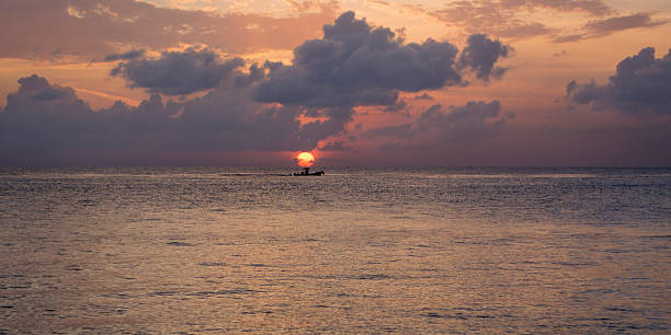 istock Boat in Caribbean at sunset 496664893