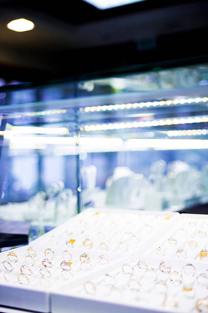 istock many gold rings on display at a jewelry store 496665193