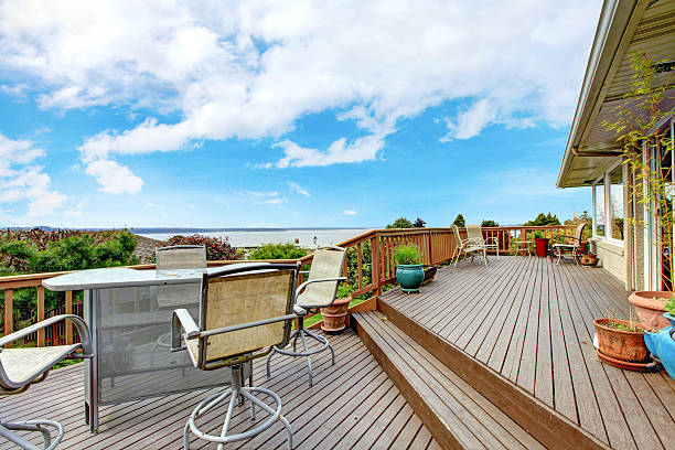istock Walkout deck with patio area and water view 496665659