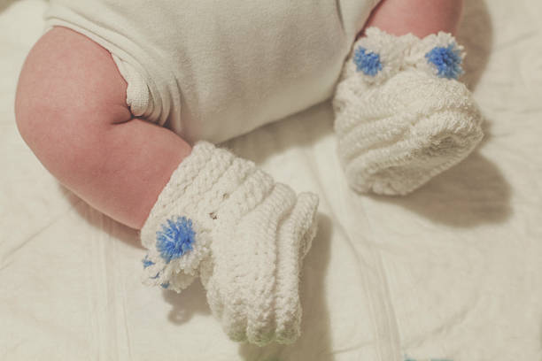 Baby clothes with a hole in the foot.