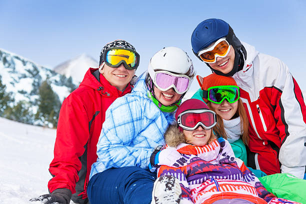 istock Five happy smiling friends with snowboards 496666209