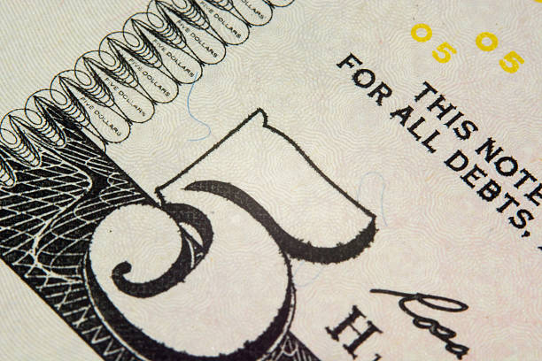 istock five us Dollar bill, super macro, close up photo 496666391