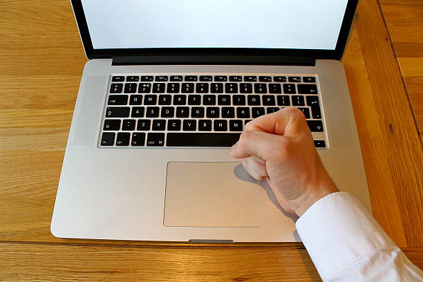 istock clenched fist on laptop 496666991