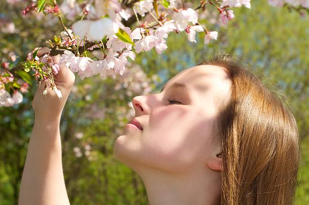 istock Woman smelling a flower 496667449