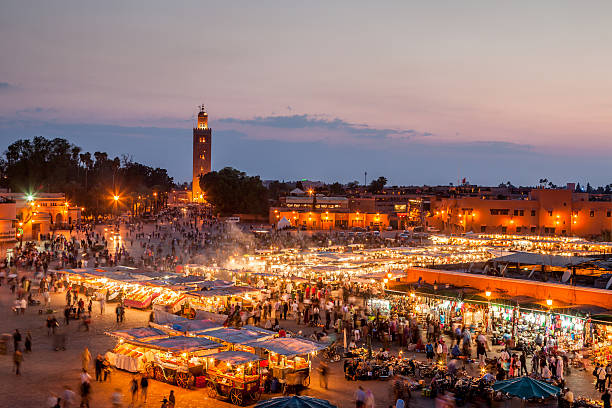 Djemma El Fna Marrakech by Night Djemma el Fna, the famous square and market place at dusk in Marrakech,Morocco marrakesh photos stock pictures, royalty-free photos & images