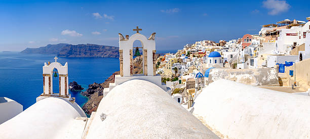 istock Panoramic view at rooftops of romantic village in Santorini 496677096