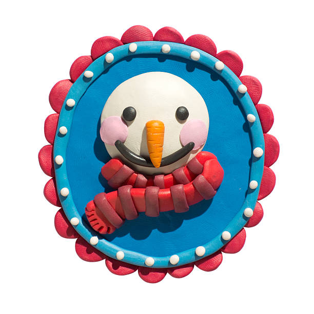 Cute snowman cartoon character wearing a scarf in frame. The picture handmade of plasticine.