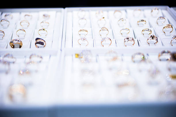 istock many gold rings on display at a jewelry store 496679179