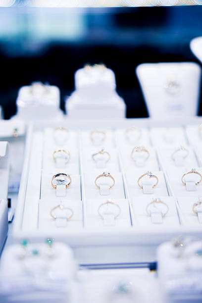 istock many gold rings on display at a jewelry store 496679187