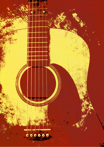 Musical vintage sepia background with acoustic guitar.