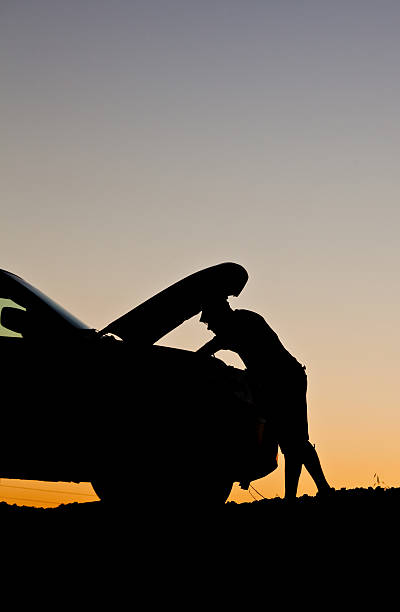 istock Silhouette of Man Having Mechanical Trouble on Highway 496679439