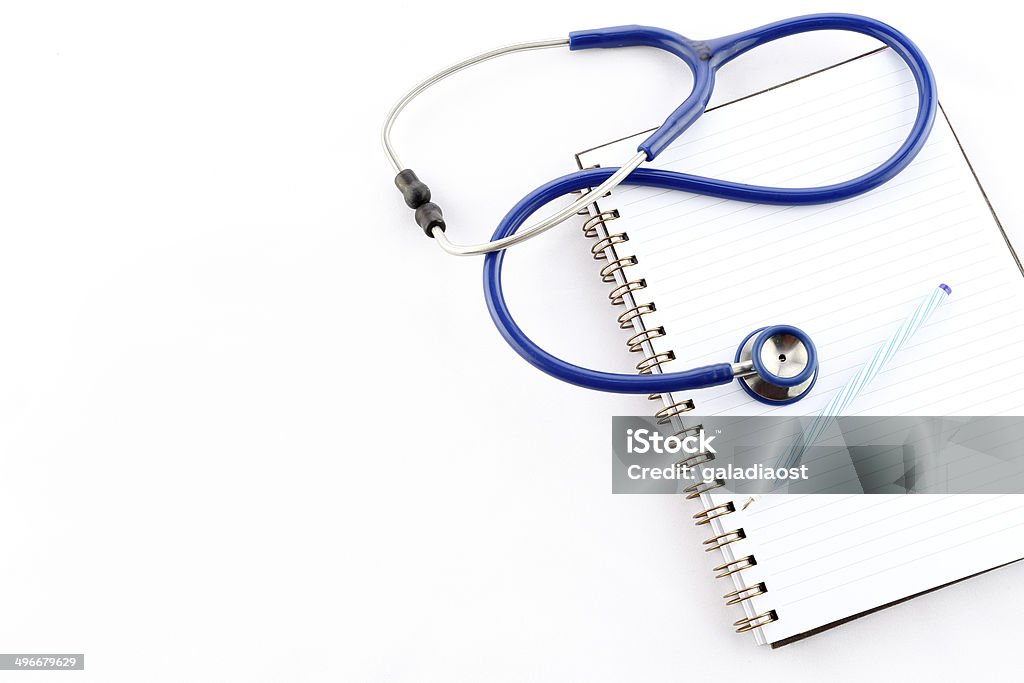 stethoscope stethoscope on open book on a white background Book Stock Photo