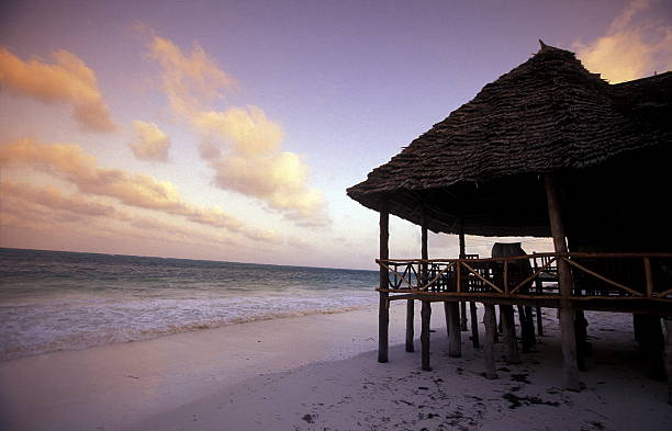 The sandy beach at Bwejuu on the east coast of the island of Zanzibar in the Indian Ocean in Tanzania in East Africa.