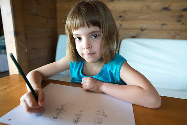 istock Little girl drawing 496680669