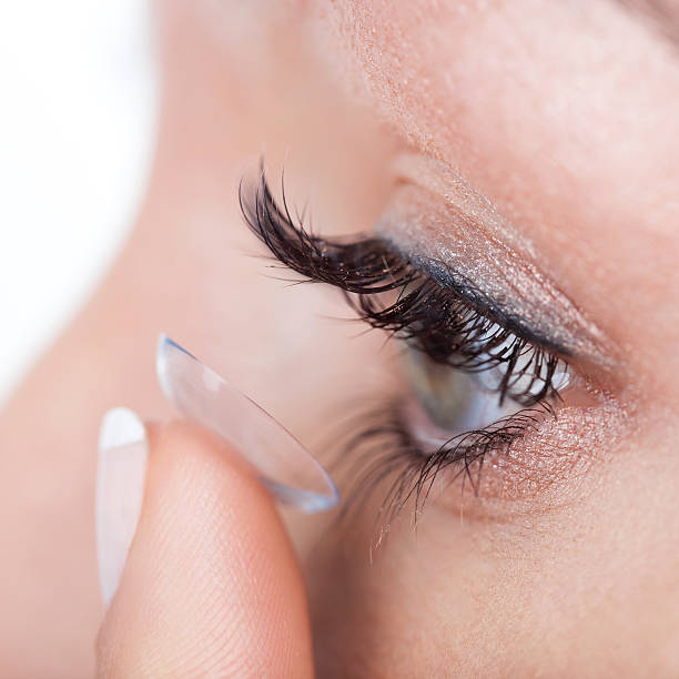 istock Woman eye with contact lens applying 496681081