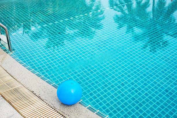 istock Inflatable ball beside swimming pool 496681408