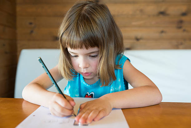 istock Little girl drawing a straight 496682715