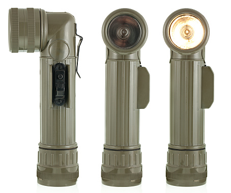 Vintage flashlight. Military old flashlight. One of the symbols of Vietnam War.