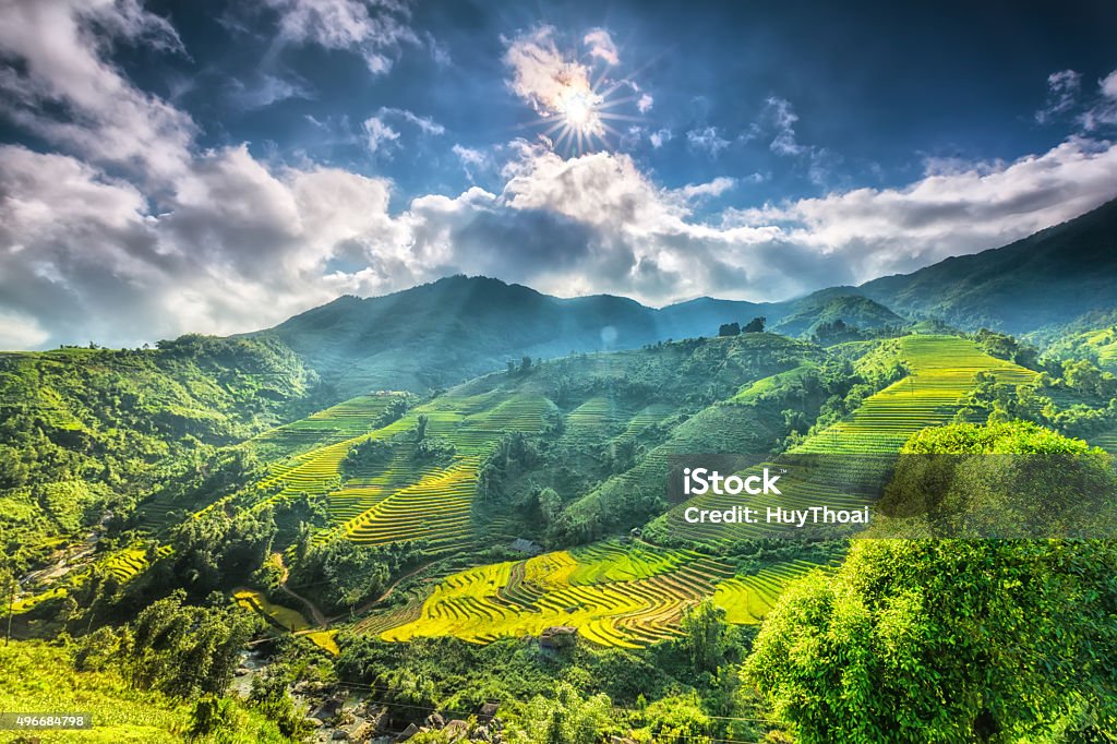 Sun star above the beautiful highland Sapa Sun star above the beautiful highland Sapa with its rays to the valley with terraces around the hill look impressive Vietnam Stock Photo
