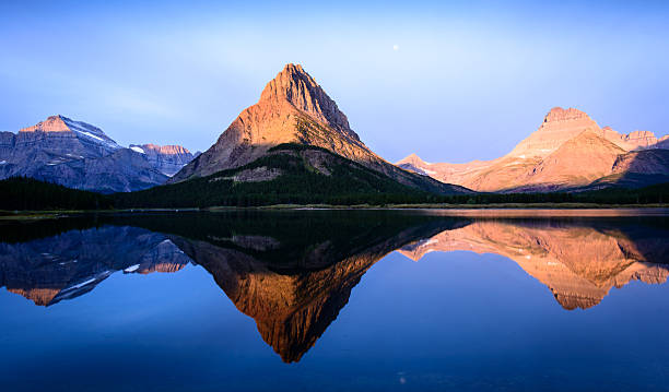 istock Reflections in Many Glacier Lake 496685217
