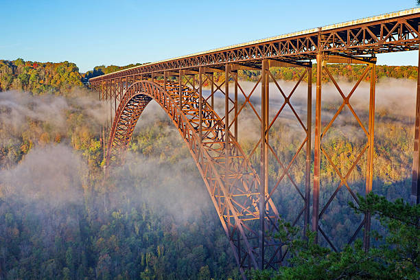 New River Gorge Bridge in Foggy Morning Fall Color stock photo